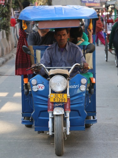 indian tuk-tuk driver in Delhi, India